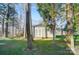 Storage shed on the wooded lot of this lake property in a yard with mature trees at 2139 Peninsula Dr, Clover, SC 29710