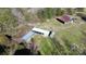 Aerial shot features multiple barn structures surrounded by lush trees at 2159 Greenleaf Rd, Clover, SC 29710