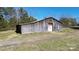 Exterior of the barn featuring rustic wood siding and a functional door at 2159 Greenleaf Rd, Clover, SC 29710