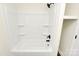 Bathroom featuring a modern white tub/shower combo with dark fixtures in a renovated space at 2159 Greenleaf Rd, Clover, SC 29710