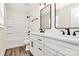 Bathroom featuring a double vanity, framed mirrors, a toilet, and tiled shower/tub combo at 2159 Greenleaf Rd, Clover, SC 29710