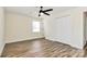 Bedroom with wood-look floors, large closet with double doors, and a ceiling fan at 2159 Greenleaf Rd, Clover, SC 29710