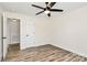 Cozy bedroom featuring neutral walls, wood flooring, and closet at 2159 Greenleaf Rd, Clover, SC 29710