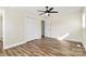 Bedroom featuring wood-look floors, a ceiling fan, a closet with double doors and a window at 2159 Greenleaf Rd, Clover, SC 29710