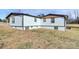 View of the home's exterior featuring white siding, gray trim, and a crawl space foundation at 2159 Greenleaf Rd, Clover, SC 29710