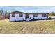 Charming single-story home featuring white painted brick and dark shutters at 2159 Greenleaf Rd, Clover, SC 29710