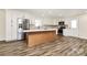 Bright kitchen featuring white cabinets, stainless steel appliances, and a center island with seating at 2159 Greenleaf Rd, Clover, SC 29710