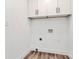 Laundry area with white cabinets and modern flooring at 2159 Greenleaf Rd, Clover, SC 29710