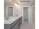 Bathroom featuring a double vanity with quartz countertops and a glass shower at 2216 Camber Dr # Cwo0074, Gastonia, NC 28054