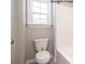 Well-lit bathroom featuring a white toilet next to a window and shower over tub at 2216 Camber Dr # Cwo0074, Gastonia, NC 28054