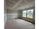 Spacious bedroom featuring bright windows and drywall ready for paint in a new construction home at 2216 Camber Dr # Cwo0074, Gastonia, NC 28054