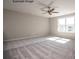 Bedroom featuring carpet flooring, neutral paint, a ceiling fan, and a large window at 2216 Camber Dr # Cwo0074, Gastonia, NC 28054