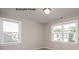 Bedroom with two large windows providing natural light, neutral paint, and carpet flooring at 2216 Camber Dr # Cwo0074, Gastonia, NC 28054
