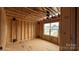 Unfinished room space showcasing a large window overlooking neighborhood at 2216 Camber Dr # Cwo0074, Gastonia, NC 28054