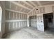 Unfinished bedroom with view to hallway and window and bare floors at 2216 Camber Dr # Cwo0074, Gastonia, NC 28054