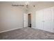 Bright bedroom with plush carpeting, modern light fixture, and an ensuite bathroom at 2216 Camber Dr # Cwo0074, Gastonia, NC 28054