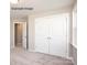 Bedroom featuring carpet flooring, double doors to closet, window, and neutral paint at 2216 Camber Dr # Cwo0074, Gastonia, NC 28054