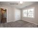 Bedroom featuring neutral walls, plush carpeting, a large window, and a closet, showing a new home's design at 2216 Camber Dr # Cwo0074, Gastonia, NC 28054