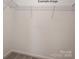 A walk-in closet with wire shelving and neutral carpeting at 2216 Camber Dr # Cwo0074, Gastonia, NC 28054