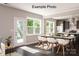 Open concept dining room next to kitchen with hardwood floors and views of the backyard at 2216 Camber Dr # Cwo0074, Gastonia, NC 28054