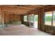 Unfinished interior with exposed wood frame, new windows, and a view of the outdoors at 2216 Camber Dr # Cwo0074, Gastonia, NC 28054