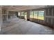 Large open living space under construction with unfinished walls, large windows, and ample natural light at 2216 Camber Dr # Cwo0074, Gastonia, NC 28054