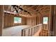 Unfinished loft showcasing a high ceiling with exposed wooden beams and natural light at 2216 Camber Dr # Cwo0074, Gastonia, NC 28054