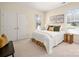 Cozy bedroom featuring natural light, a comfortable bed, and neutral decor at 2937 Bellasera Way, Matthews, NC 28105