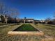 Well-maintained bocce ball court adjacent to a community pavilion and seating area at 2937 Bellasera Way, Matthews, NC 28105