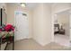 Inviting entryway featuring tile floors, a white front door, and view to bedroom at 2937 Bellasera Way, Matthews, NC 28105