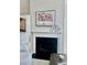 Elegant fireplace mantel with a floral painting and decorative elements at 2937 Bellasera Way, Matthews, NC 28105
