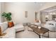 Inviting living room with neutral decor, ample seating, and a view to the dining room at 2937 Bellasera Way, Matthews, NC 28105