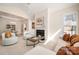 Bright living space with fireplace, adjacent dining area, and open layout at 2937 Bellasera Way, Matthews, NC 28105