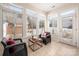 Bright sunroom with large windows, tile floors, and comfortable seating at 2937 Bellasera Way, Matthews, NC 28105