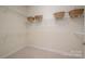 Spacious walk-in closet with adjustable shelving for customizable storage solutions at 2937 Bellasera Way, Matthews, NC 28105