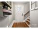 Foyer with wood floors, stairs, and a modern light fixture at 316 S Summit Ave, Charlotte, NC 28208