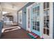 Inviting front porch with a swing and a vibrant 'HELLO' door mat by the blue front door at 316 S Summit Ave, Charlotte, NC 28208