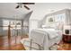 Bright main bedroom with hardwood floors, a ceiling fan, and staircase access at 316 S Summit Ave, Charlotte, NC 28208