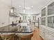 Bright kitchen features stainless steel appliances, center island, and breakfast bar seating, perfect for entertaining at 3915 Ayscough Rd, Charlotte, NC 28211