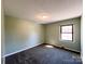 Cozy bedroom with neutral walls, comfortable carpeting, and natural light, offering a tranquil retreat at 4069 Amsbury Rd, Concord, NC 28025