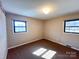 Bedroom with natural light from two windows creating a bright and airy space at 4069 Amsbury Rd, Concord, NC 28025