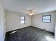 Serene bedroom with two windows, carpeted floors, and soft lighting, creating a relaxing and inviting space at 4069 Amsbury Rd, Concord, NC 28025