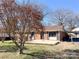Charming brick home with a cozy front yard, perfect for outdoor relaxation and curb appeal at 4069 Amsbury Rd, Concord, NC 28025