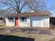 Detached one-car garage with red door and light yellow siding, providing extra parking or storage at 4069 Amsbury Rd, Concord, NC 28025