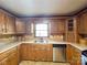 Functional kitchen with wood cabinetry, stainless steel dishwasher, and ample counter space, a home chef's delight at 4069 Amsbury Rd, Concord, NC 28025
