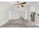 Open living room with carpet, neutral walls, and an entry to a hallway and other areas of the house at 414 Glencroft Dr, Wingate, NC 28174