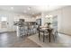 Modern kitchen with stainless steel appliances, granite countertops, and seating at the island at 418 Babbling Brook Ln # 245B, Locust, NC 28097