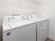 Convenient laundry room with washer, dryer, and overhead storage shelf at 418 Babbling Brook Ln # 245B, Locust, NC 28097