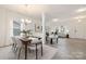 Open living space with a dining area and a view into the adjacent living room at 418 Babbling Brook Ln # 245B, Locust, NC 28097
