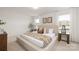 Serene main bedroom with neutral tones, decorative pillows, side tables with lamps and natural light at 418 Babbling Brook Ln # 245B, Locust, NC 28097